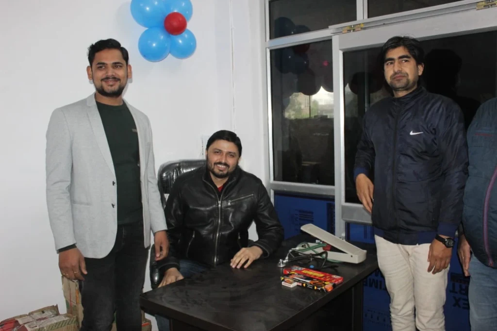 Dr. Shahrukh Firoz with medical colleagues at consultation desk