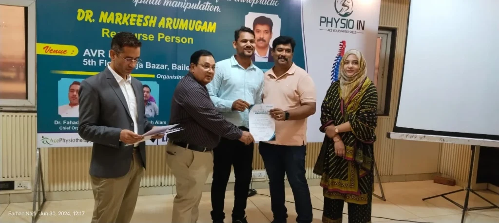 Dr. Shahrukh Firoz receiving clinical certification at Physio IN Conference
